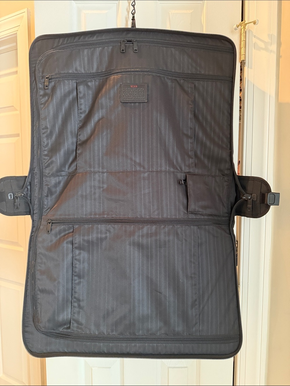 Tumi Black Fold-Open Garment Bag with Multiple Zip Pockets